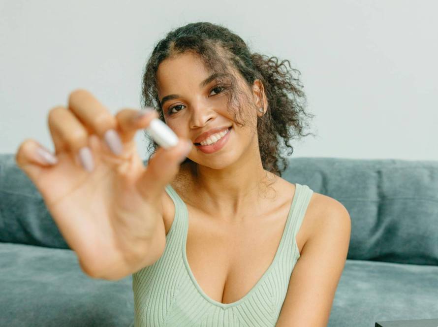 Woman holding supplement